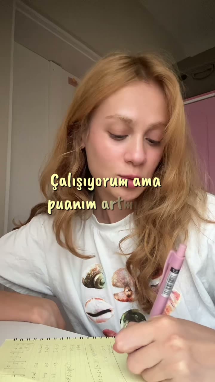 A student filming a hands-on study routine at her desk